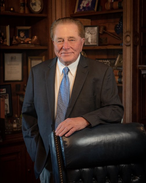 James J. Reeves standing in his office